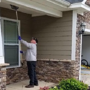 Croach Exterminator Treating Porch Ceiling and Eaves - 300x300