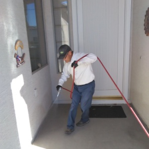 Croach Pest Control Exterminator - Cottonwood Heights, Utah - Spraying Front Entry of Home - 300x300
