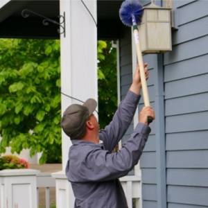 Croach Pest Control-Tech Cleans Spider Webs-Maple Valley WA-Croach Pest Control-300x300