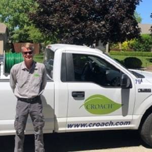 Croach Pest Control Tech next to Vehicle in Gig Harbor