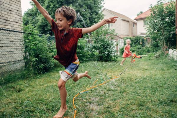 Summertime Playing in Sprinkler No Wasps or Ants-600x400