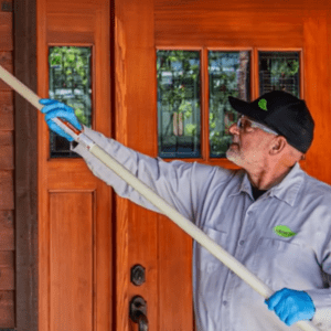 Croach Technician De-Webbing on Front Porch - Coupeville WA