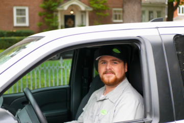King City OR - Technician Smiling In Pest Control Truck